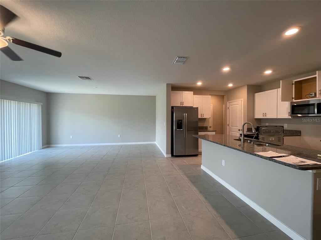 31796 Sun Kettle Loop Wesley Chapel, FL 33545 - Photo 12 of 21 a large kitchen with stainless steel appliances lots of counter top space