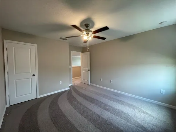 a view of a livingroom with a ceiling fan