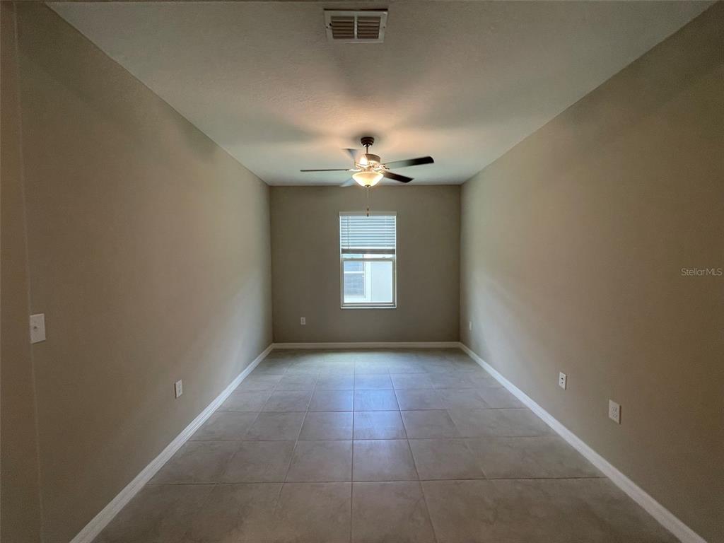 31796 Sun Kettle Loop Wesley Chapel, FL 33545 - Photo 5 of 21 a view of an empty room with a window