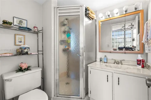 a bedroom with a bed and a lamp