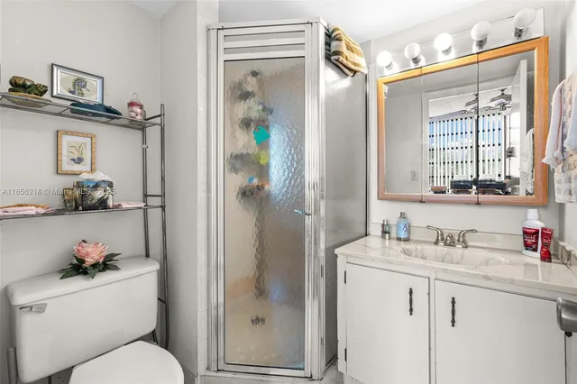 a bedroom with a bed and a lamp