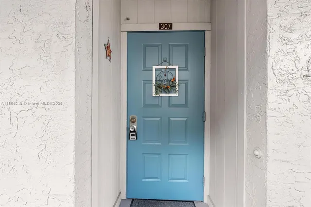 a kitchen with stainless steel appliances granite countertop a refrigerator and a stove