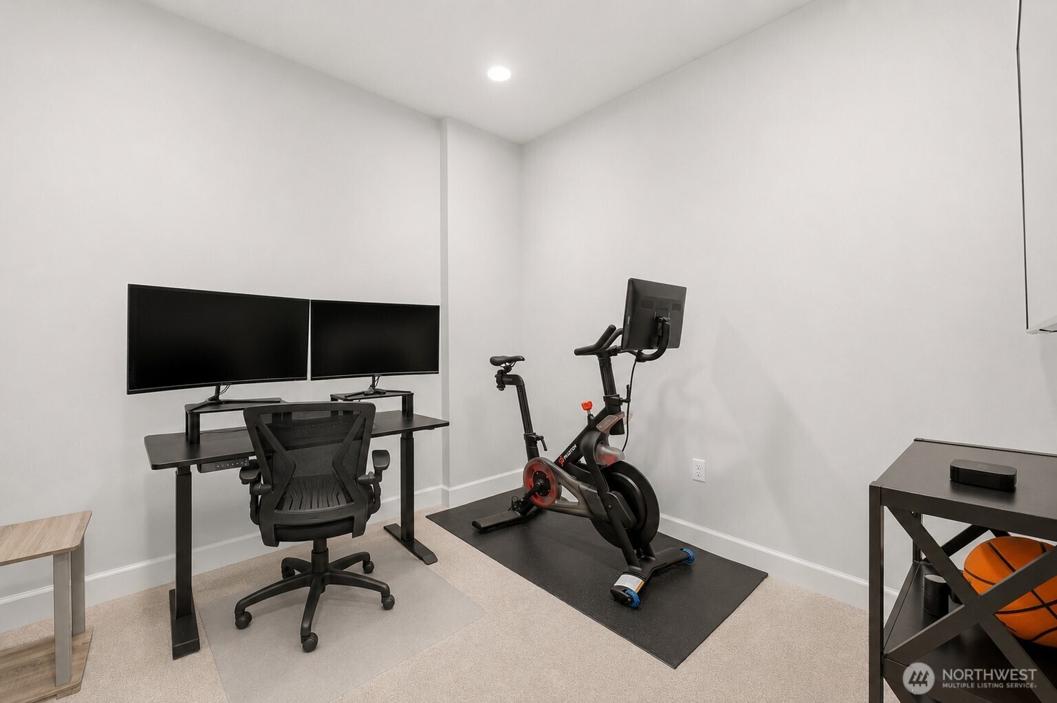 4907 Main Street, Unit 214 Tacoma, WA 98407 - Photo 19 of 34 a view of a workspace with furniture and a flat screen tv