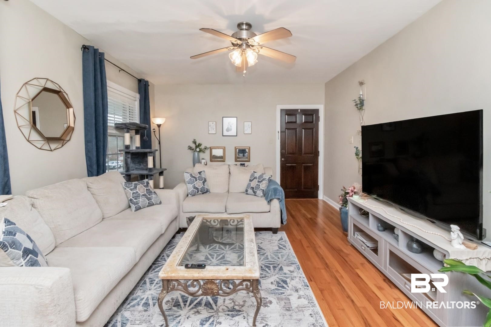214 Upham Street, Unit 17C Mobile, AL 36607 - Photo 16 of 32 Living area featuring a ceiling fan and light wood-type flooring