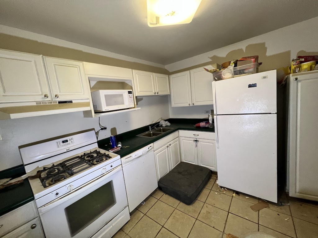 4721 St Joseph Creek Road, Unit 5F Lisle, IL 60532 - Photo 2 of 11 a kitchen with a refrigerator and a stove top oven