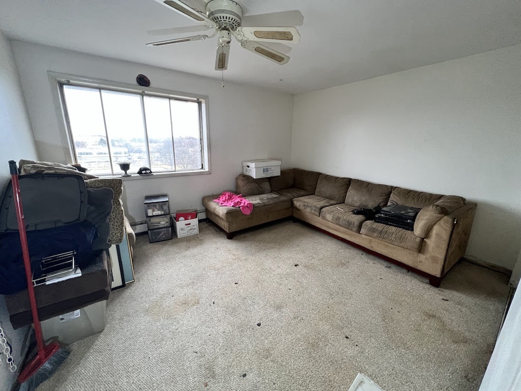 4721 St Joseph Creek Road, Unit 5F Lisle, IL 60532 - Photo 3 of 11 a living room with furniture and a window