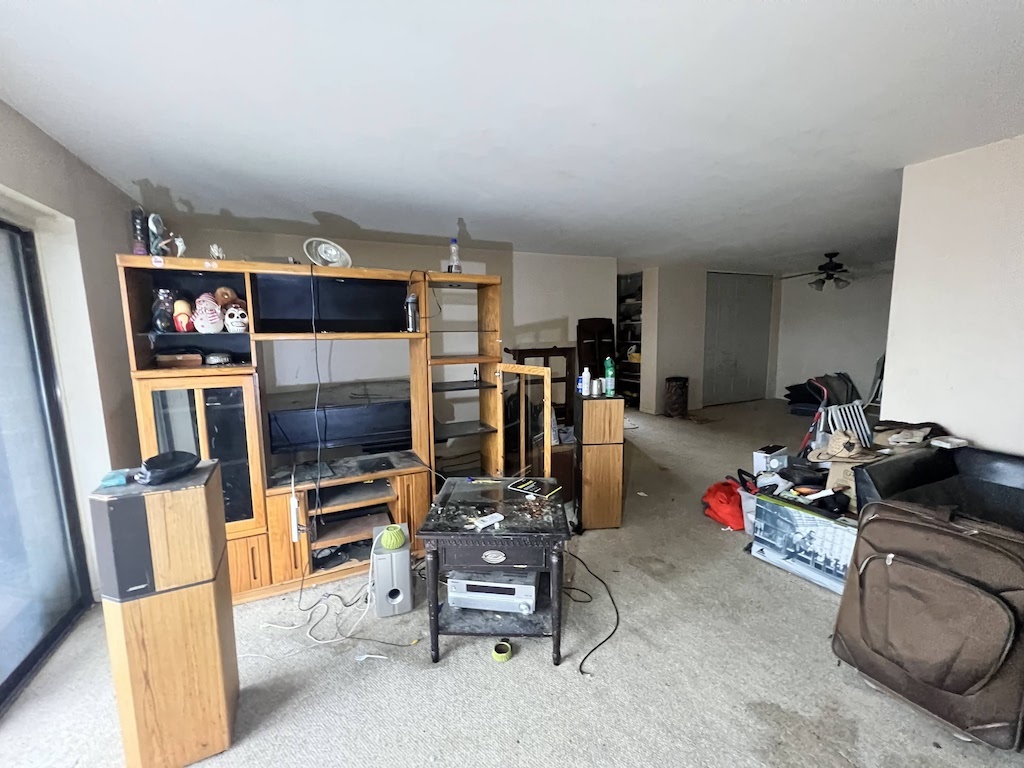 4721 St Joseph Creek Road, Unit 5F Lisle, IL 60532 - Photo 4 of 11 a room with furniture and gym equipment