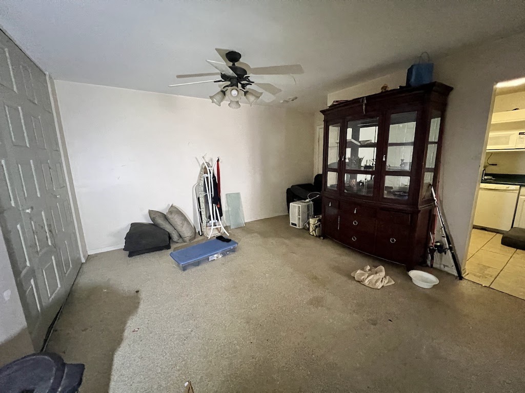 4721 St Joseph Creek Road, Unit 5F Lisle, IL 60532 - Photo 7 of 11 a living room with furniture and a window