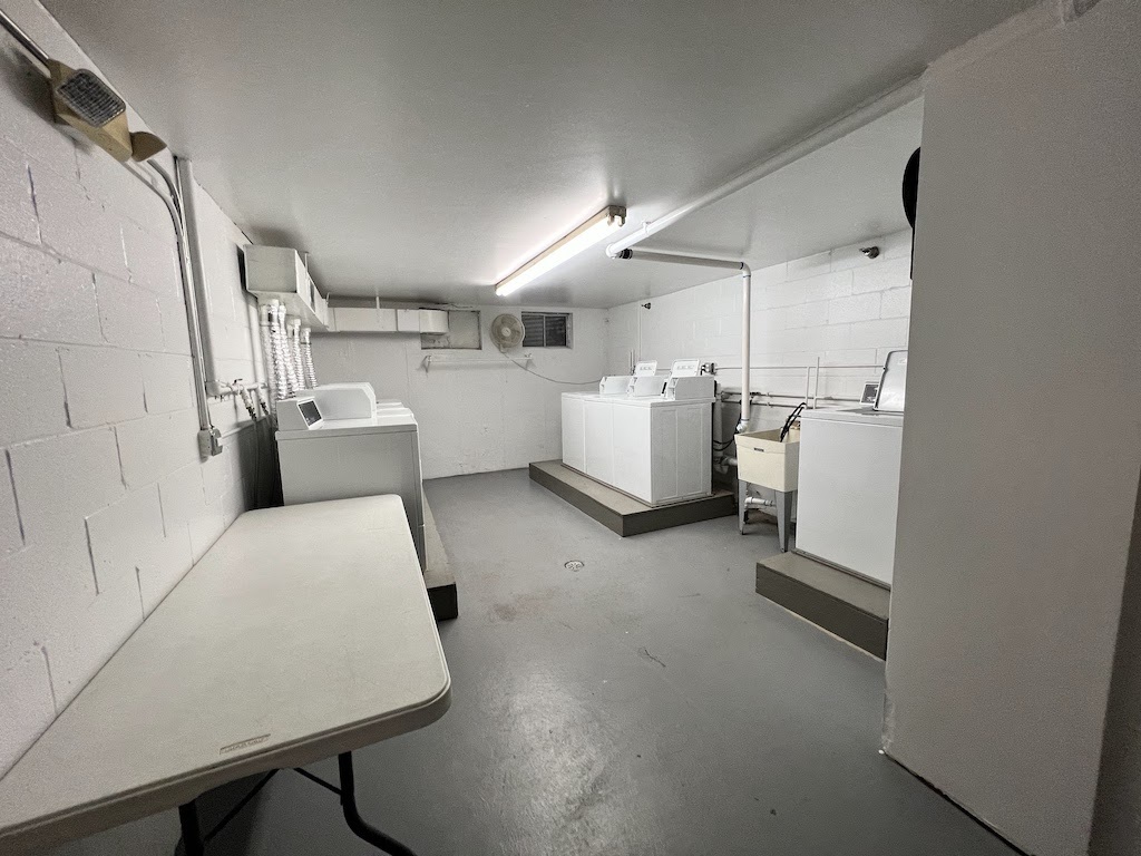 4721 St Joseph Creek Road, Unit 5F Lisle, IL 60532 - Photo 9 of 11 a bed room with furniture and a rug