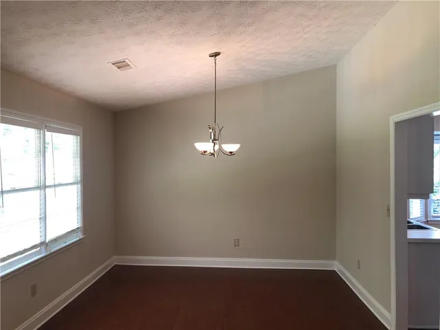 a room with a window and ceiling fan