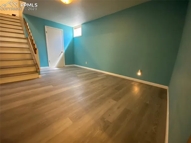 a view of an empty room with stairs