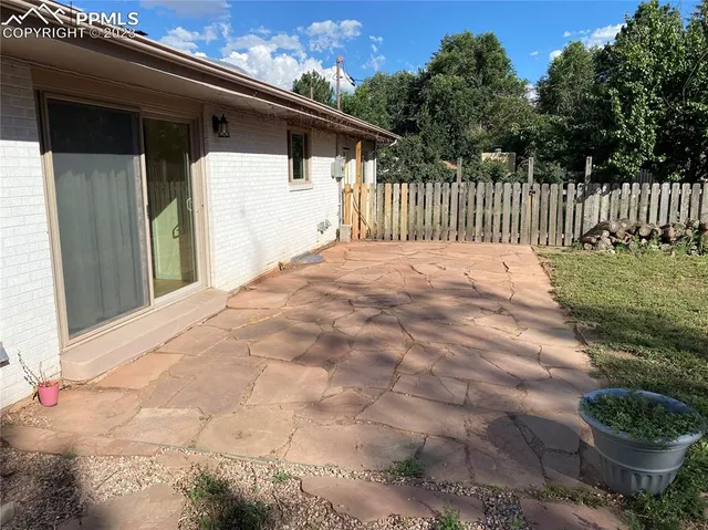 a view of a backyard of the house