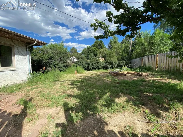 an aerial view of a house with a garden