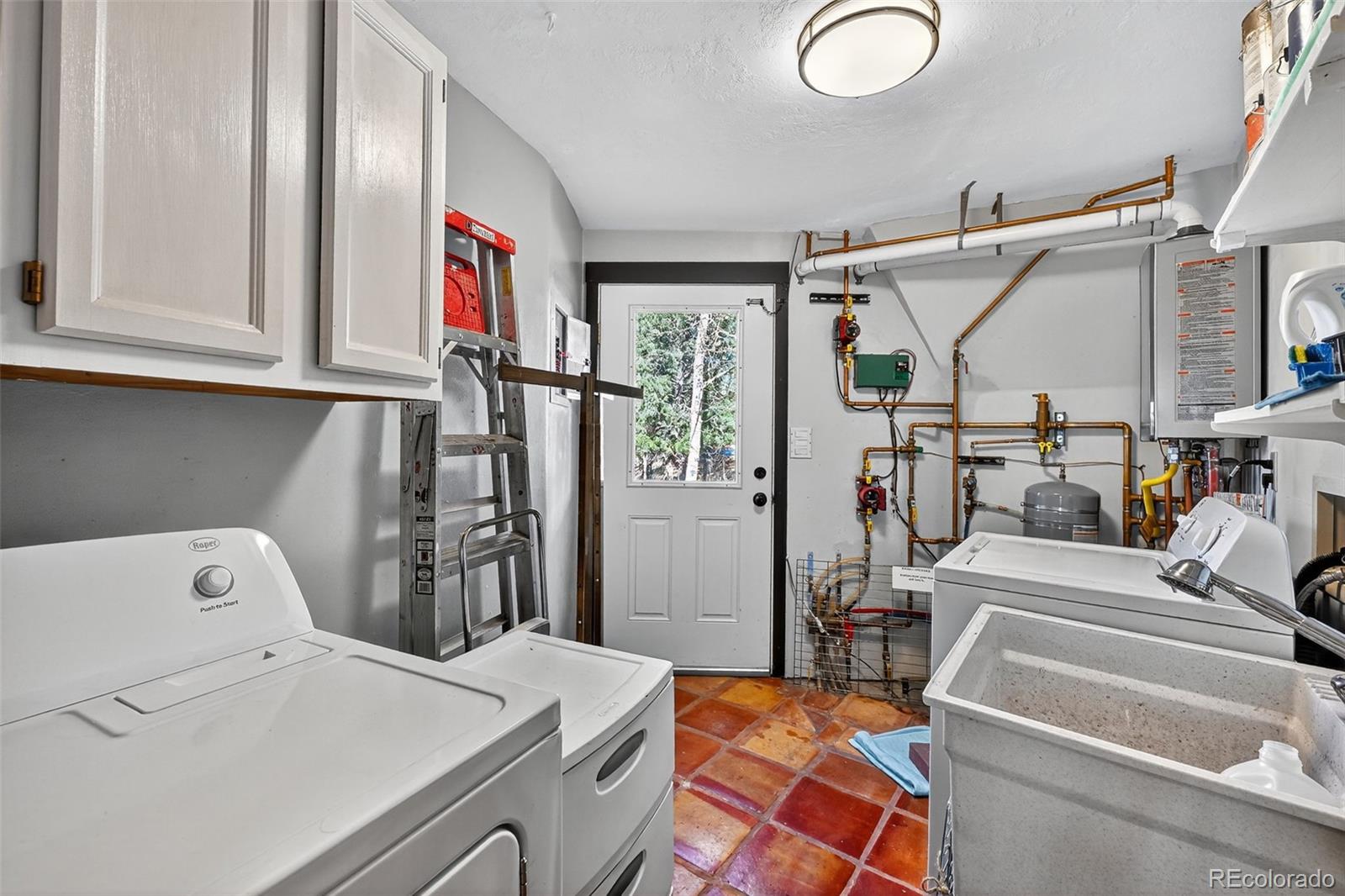 47 Aspen Road Woodland Park, CO 80863 - Photo 18 of 36 a utility room with dryer and washer