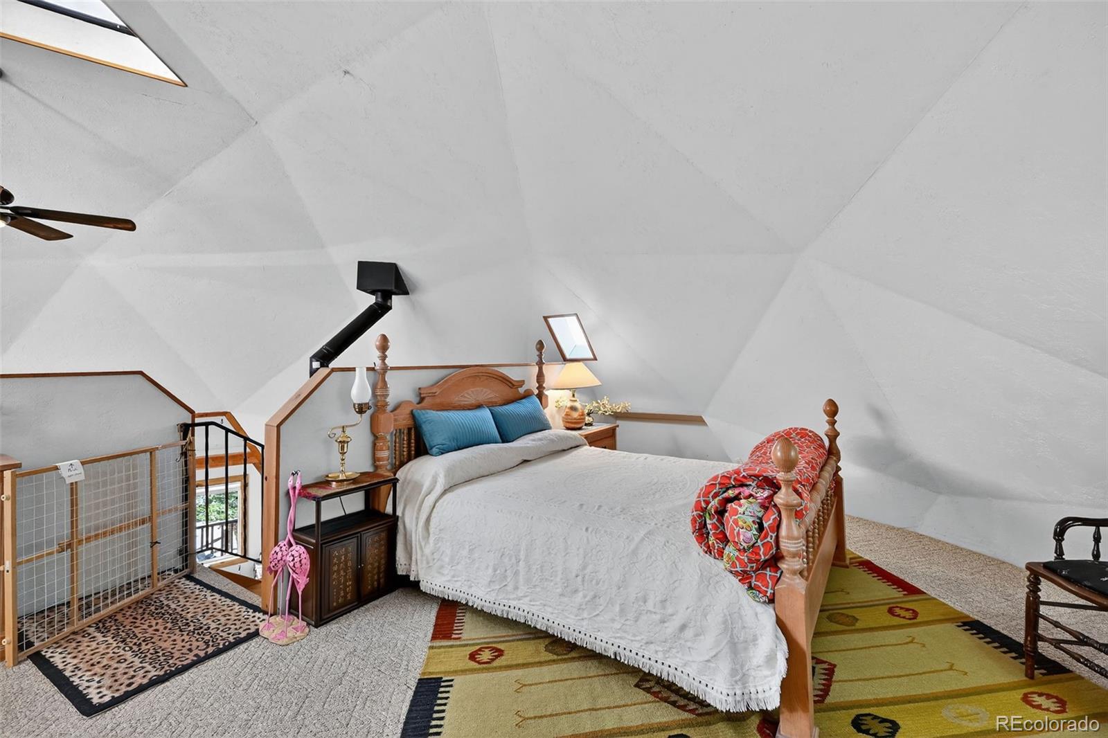 47 Aspen Road Woodland Park, CO 80863 - Photo 20 of 36 a bedroom with furniture and a window