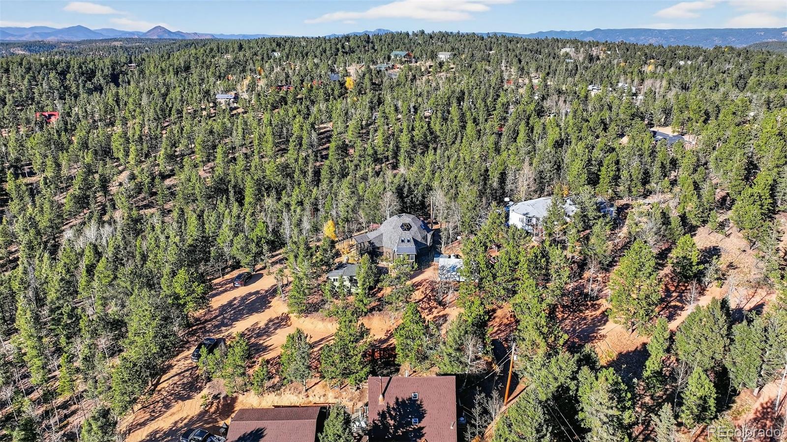47 Aspen Road Woodland Park, CO 80863 - Photo 27 of 36 a view of a city with lush green forest