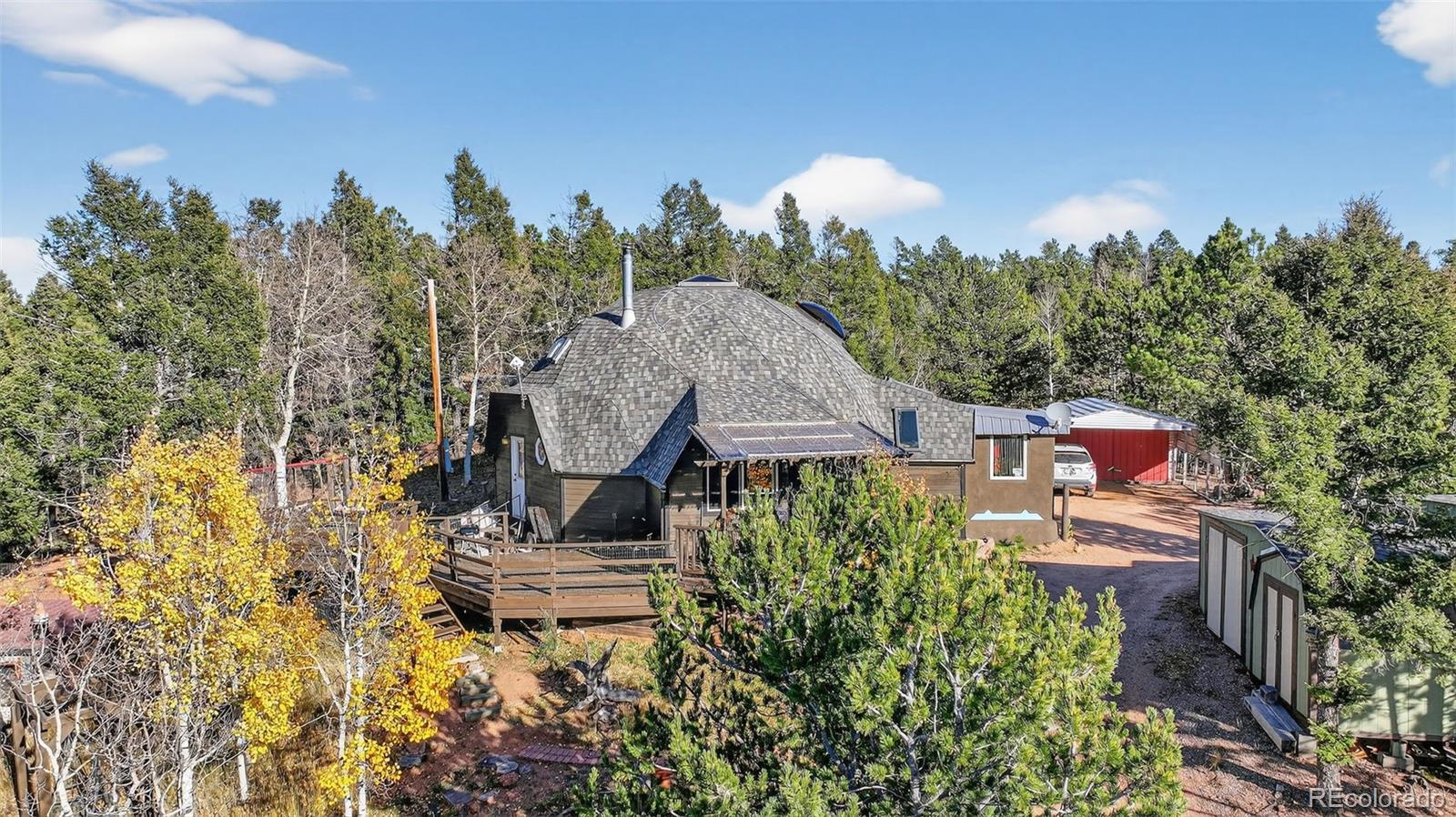 47 Aspen Road Woodland Park, CO 80863 - Photo 33 of 36 a view of a house with a yard and sitting area
