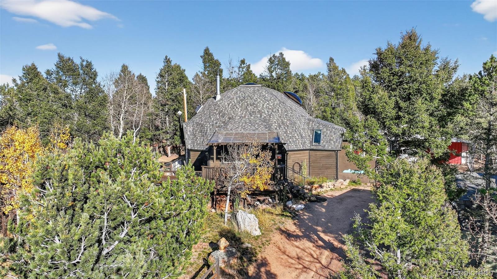 47 Aspen Road Woodland Park, CO 80863 - Photo 34 of 36 an aerial view of house with yard and trees in the background