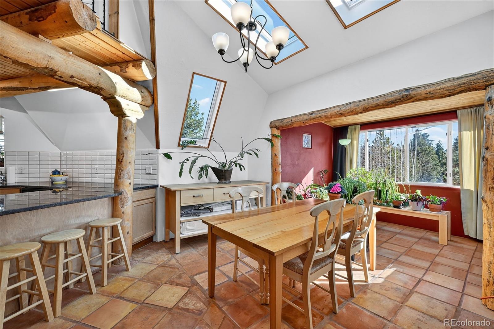 47 Aspen Road Woodland Park, CO 80863 - Photo 8 of 36 a view of a dining room with furniture window and outside view