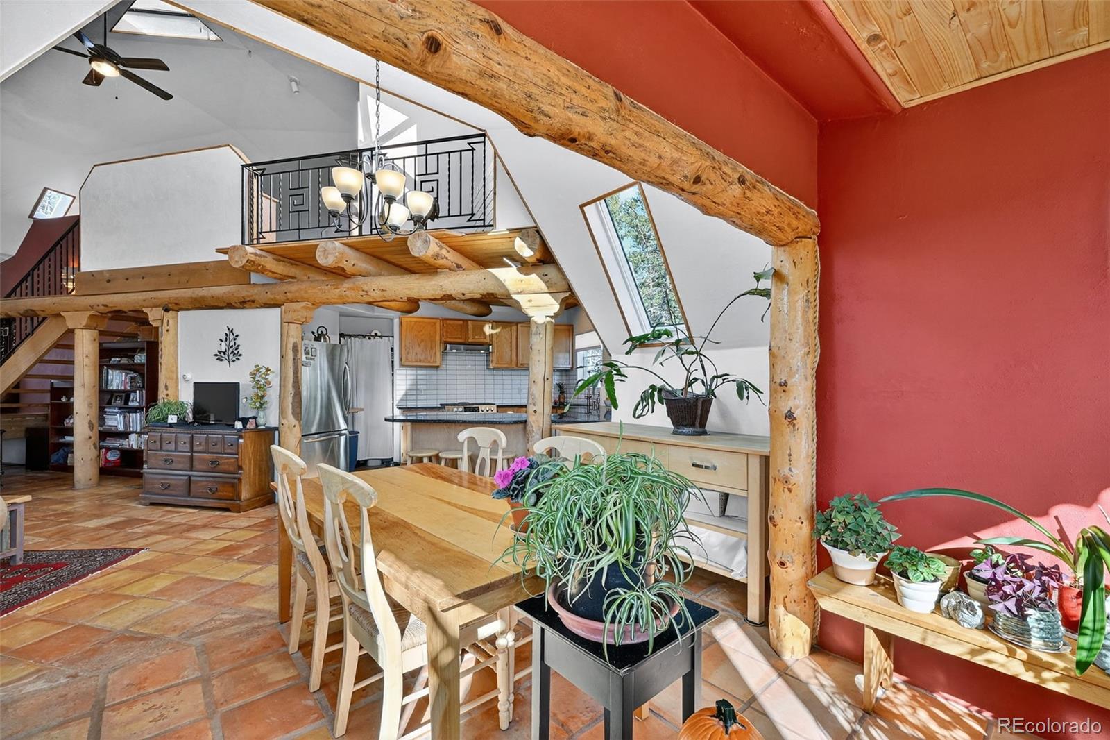 47 Aspen Road Woodland Park, CO 80863 - Photo 9 of 36 a view of a patio with table and chairs potted plants