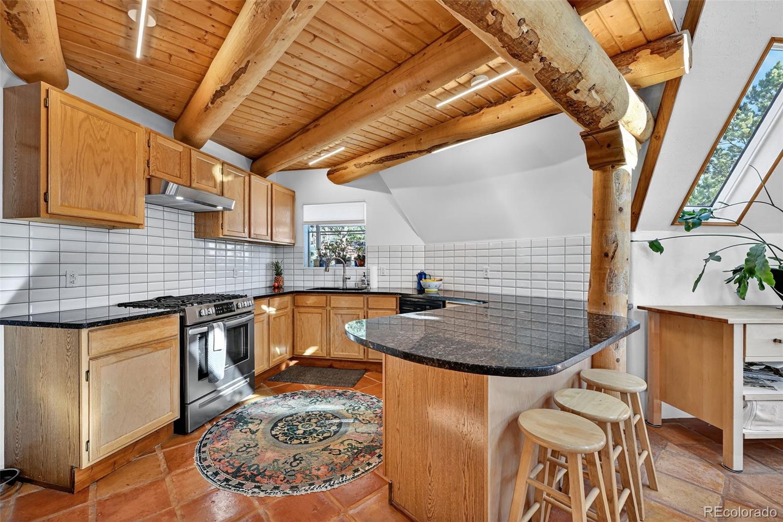 47 Aspen Road Woodland Park, CO 80863 - Photo 10 of 36 a kitchen with table and chairs