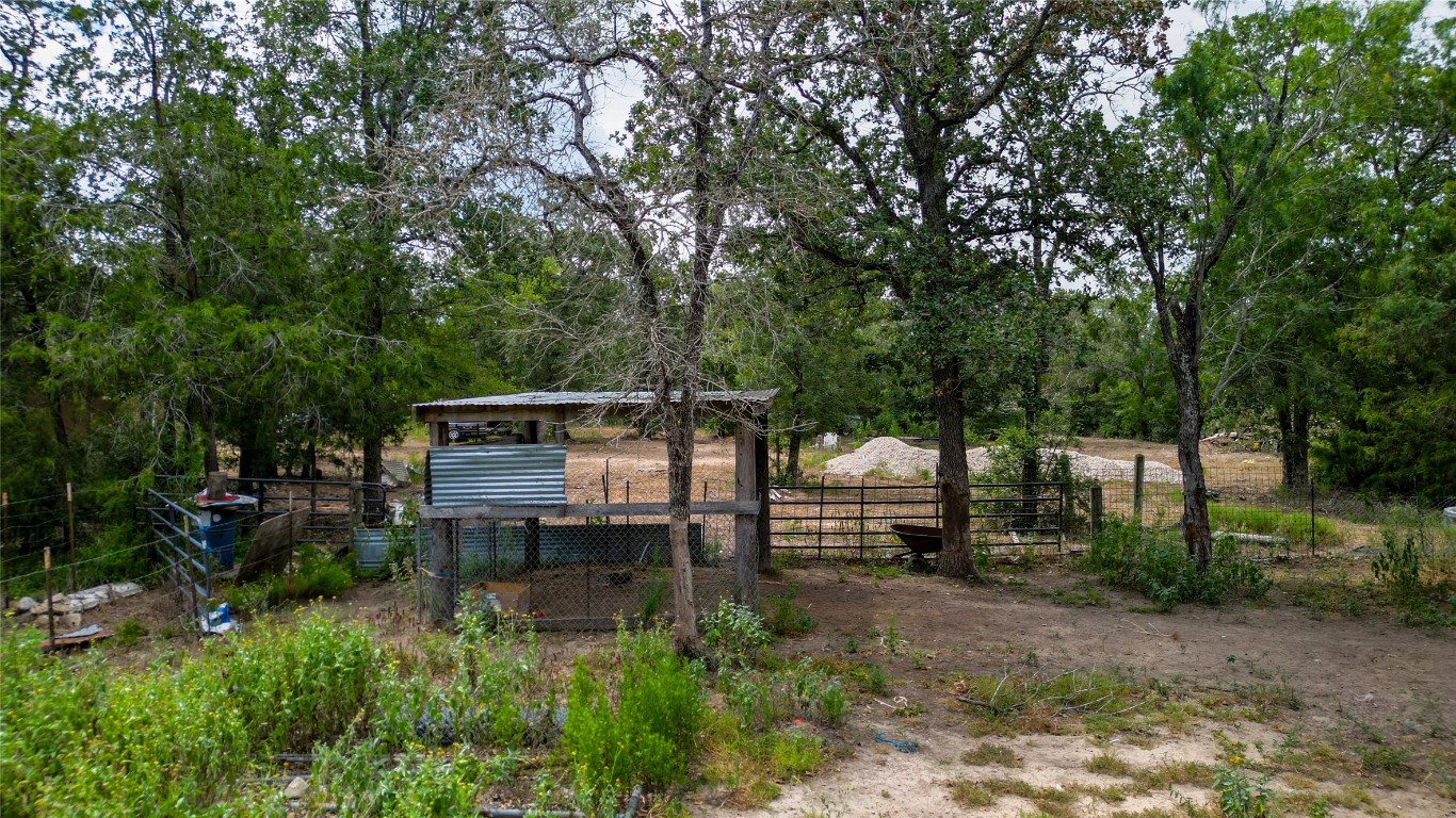 499 Bridgestone Court Lockhart, TX 78644 - Photo 32 of 36 a backyard of a house with table and chairs