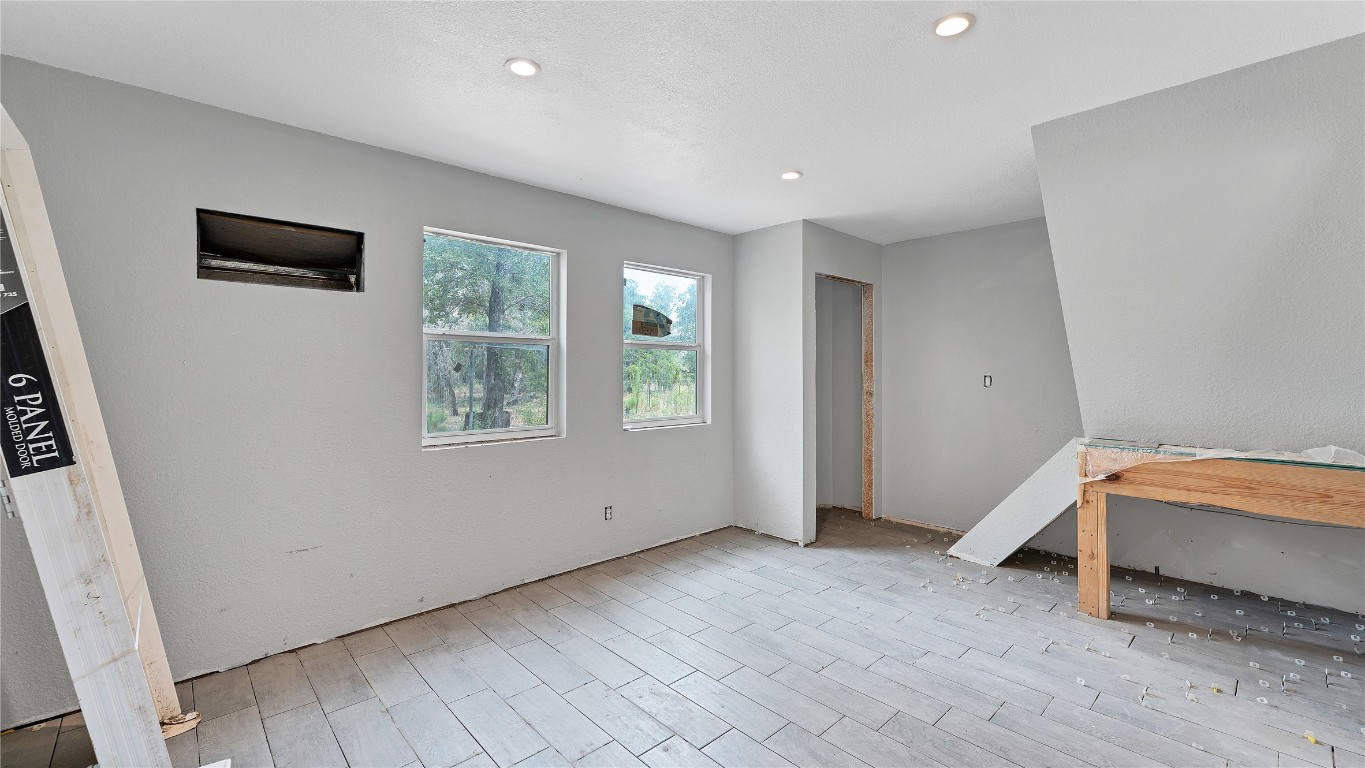 499 Bridgestone Court Lockhart, TX 78644 - Photo 9 of 36 a view of room with window and a ceiling fan