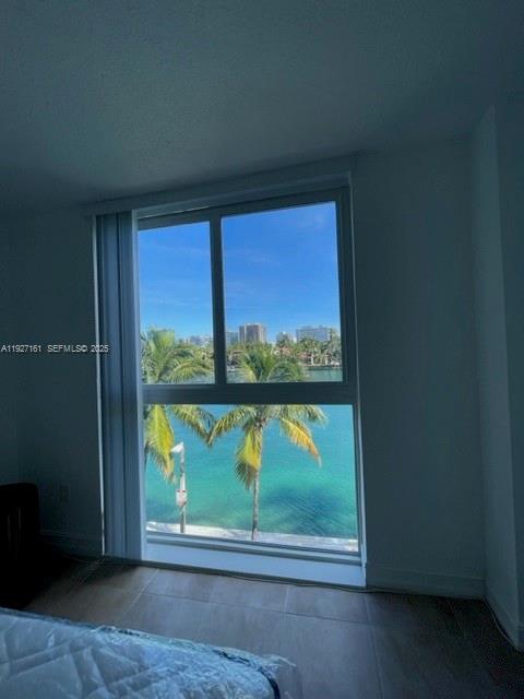 9721 East Bay Harbor Drive, Unit 3C Bay Harbor Islands, FL 33154 - Photo 16 of 17 a view of a room that has a bed and a window