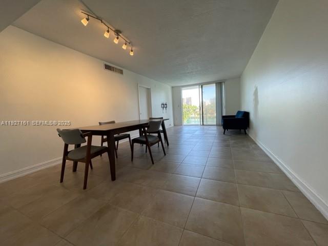9721 East Bay Harbor Drive, Unit 3C Bay Harbor Islands, FL 33154 - Photo 3 of 17 a view of a livingroom with furniture and window