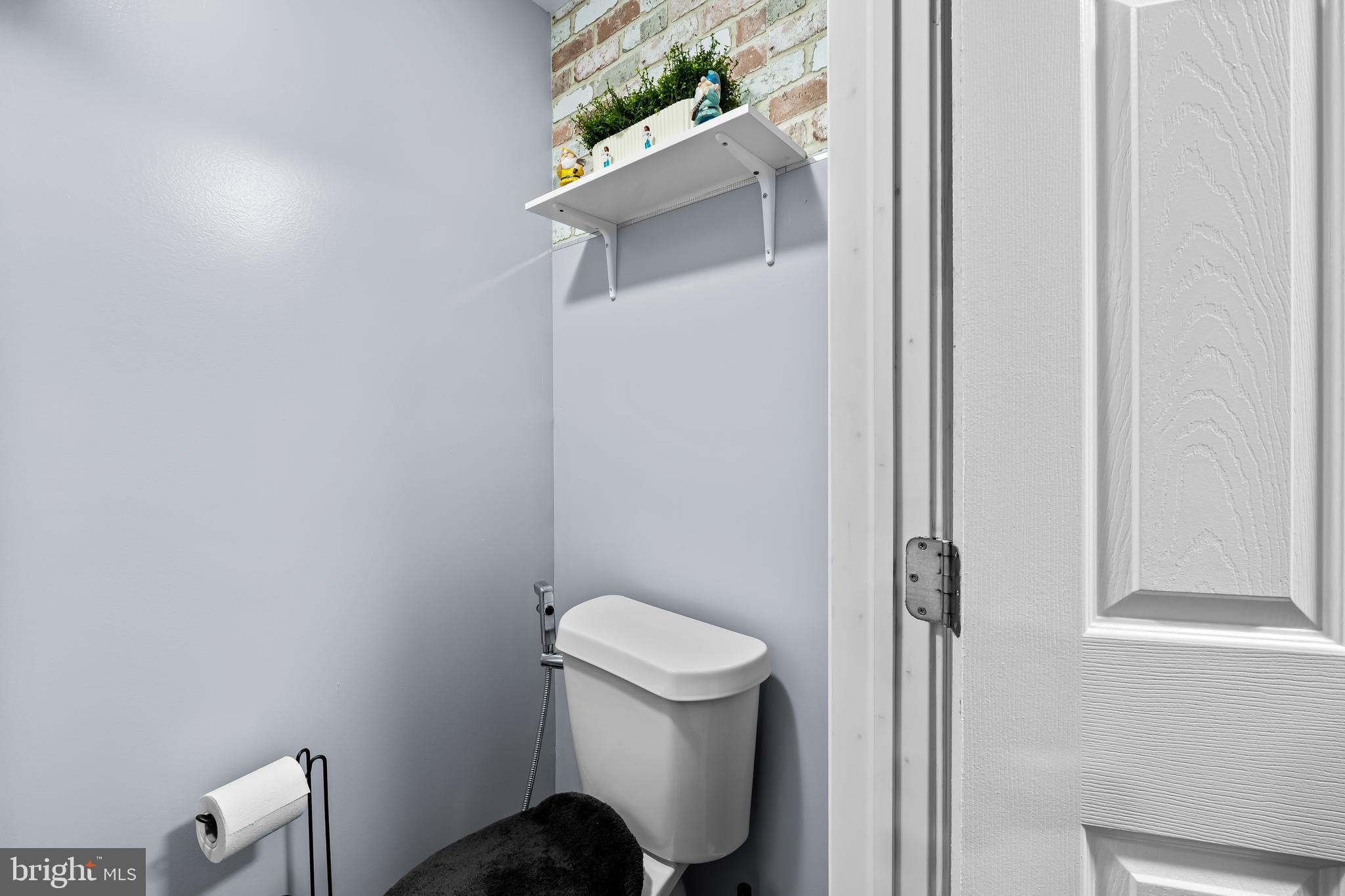 236 South Gilmor Street Baltimore, MD 21223 - Photo 12 of 28 a white toilet sitting next to a shower
