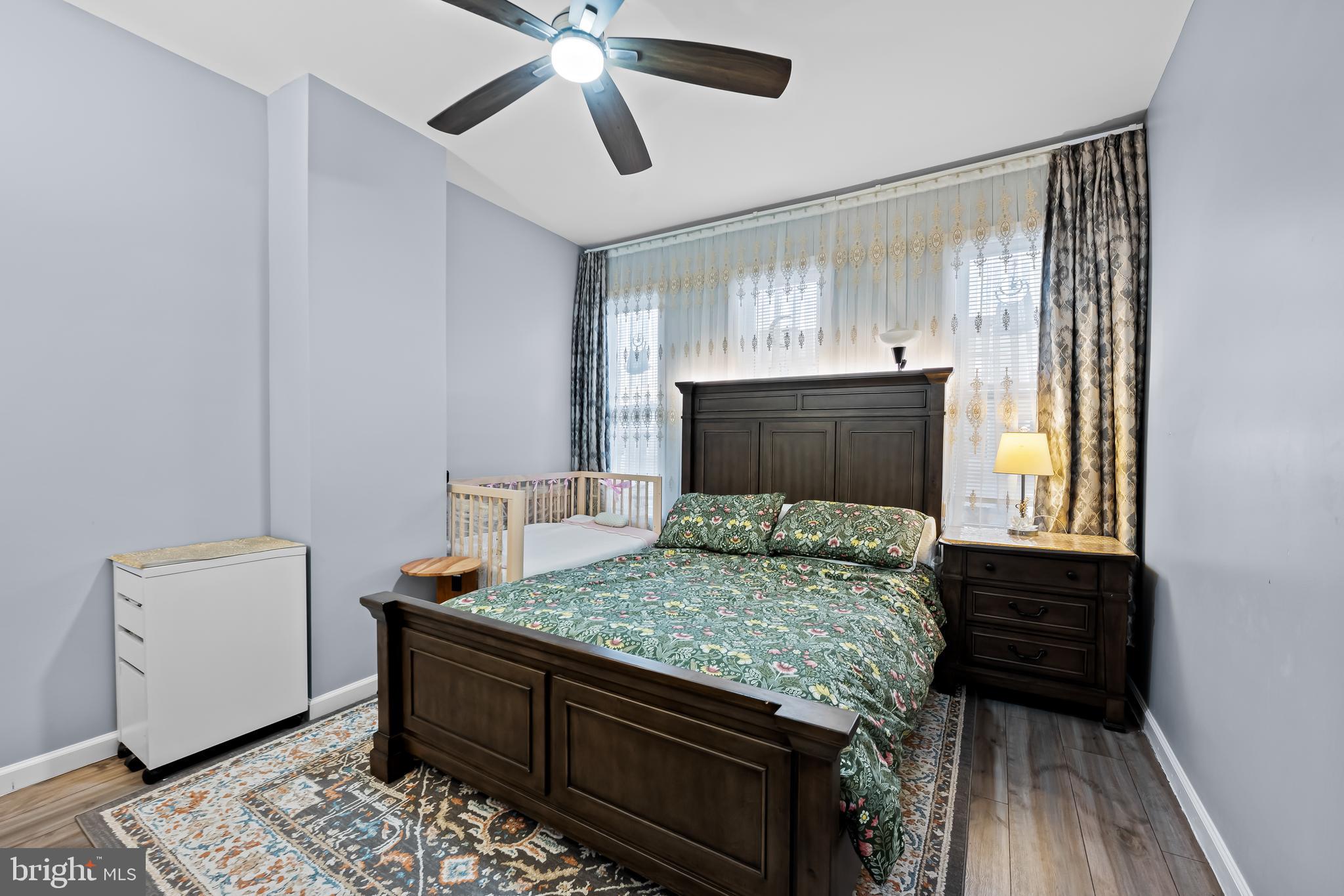 236 South Gilmor Street Baltimore, MD 21223 - Photo 15 of 28 a bed room with a bed and a window