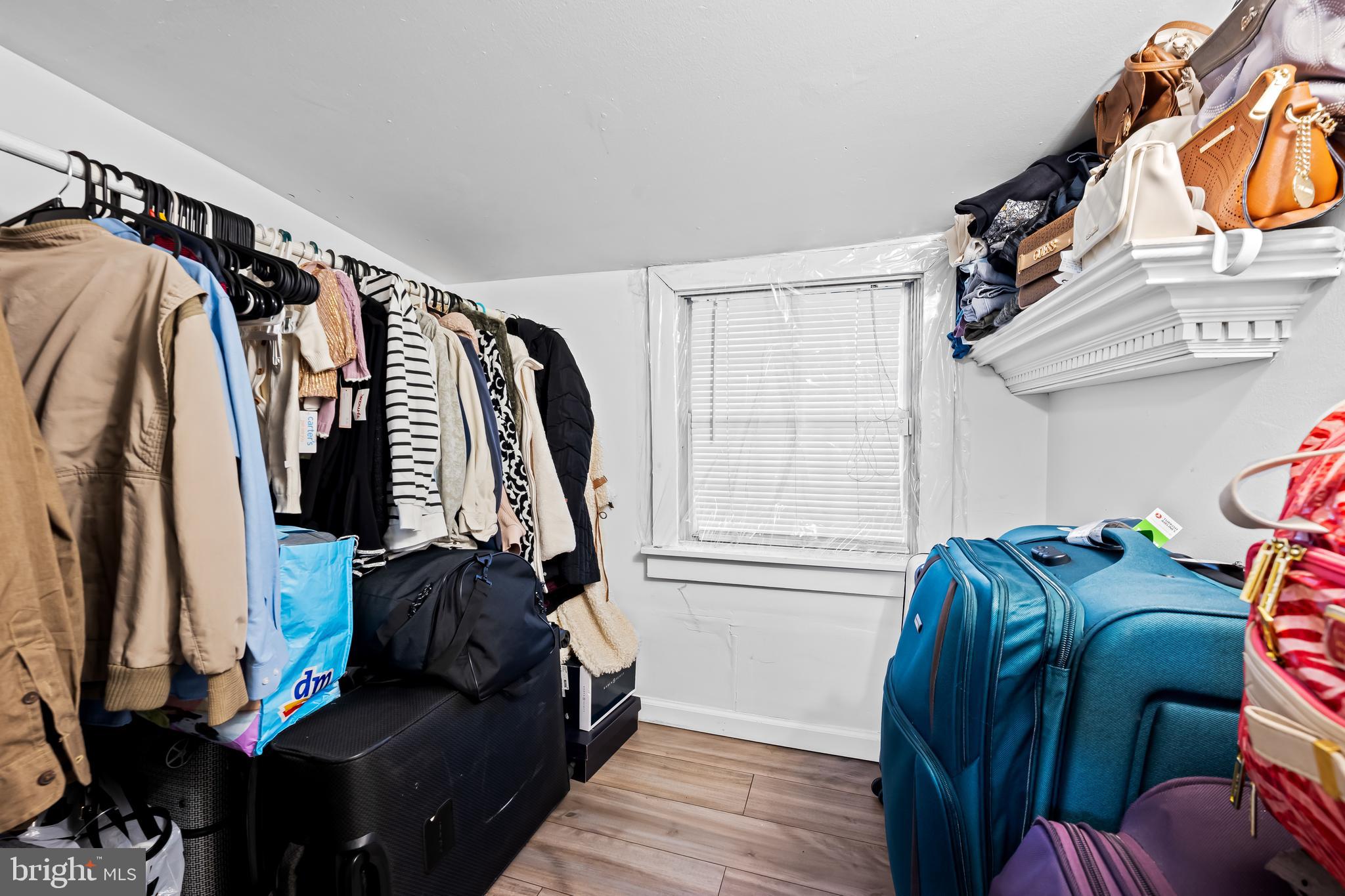 236 South Gilmor Street Baltimore, MD 21223 - Photo 20 of 28 a view of walk in closet with clothes and shoes