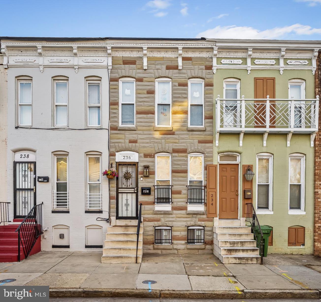 236 South Gilmor Street Baltimore, MD 21223 - Photo 2 of 28 a front view of a building with windows