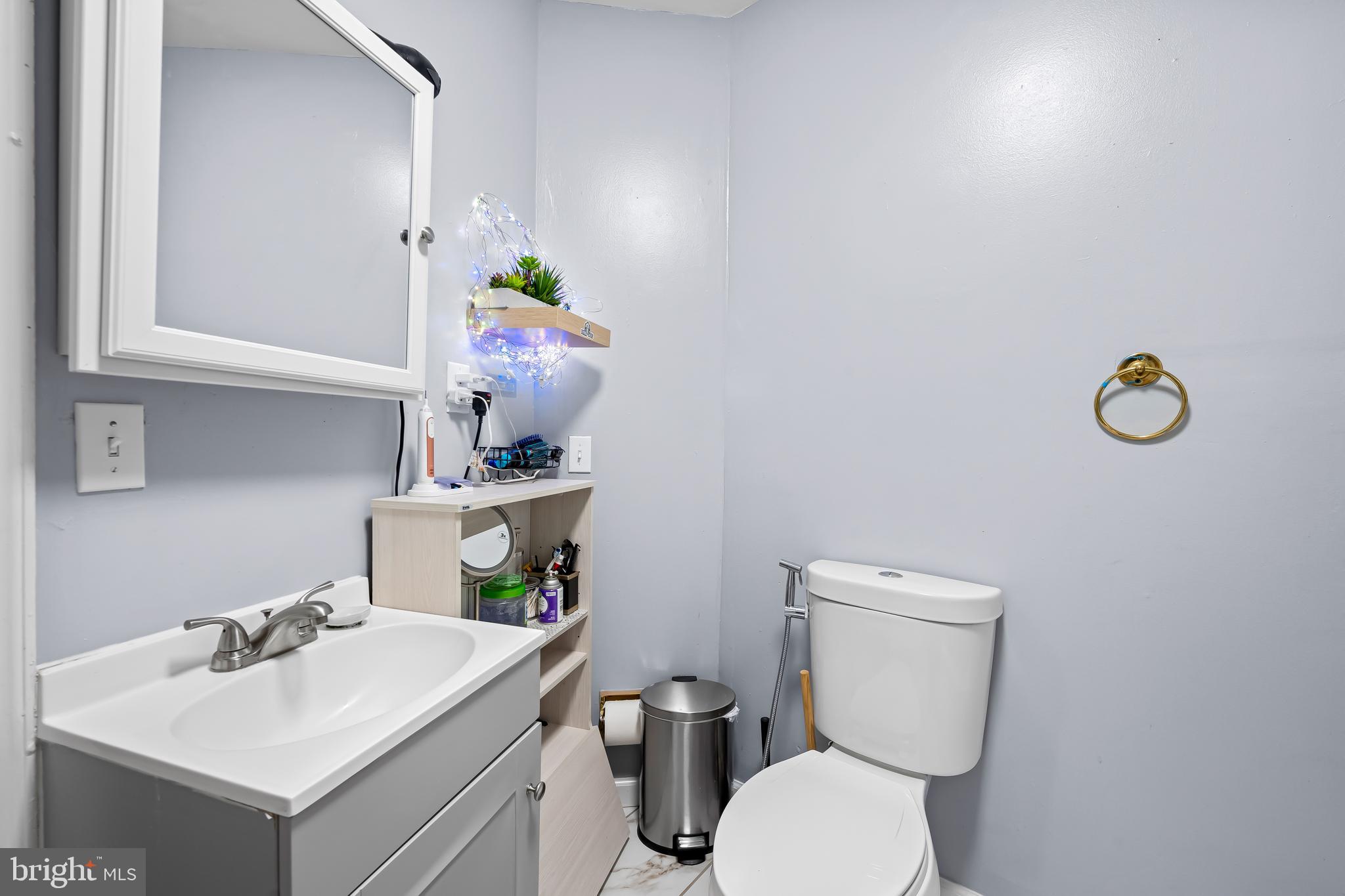 236 South Gilmor Street Baltimore, MD 21223 - Photo 21 of 28 a bathroom with a sink mirror and toilet