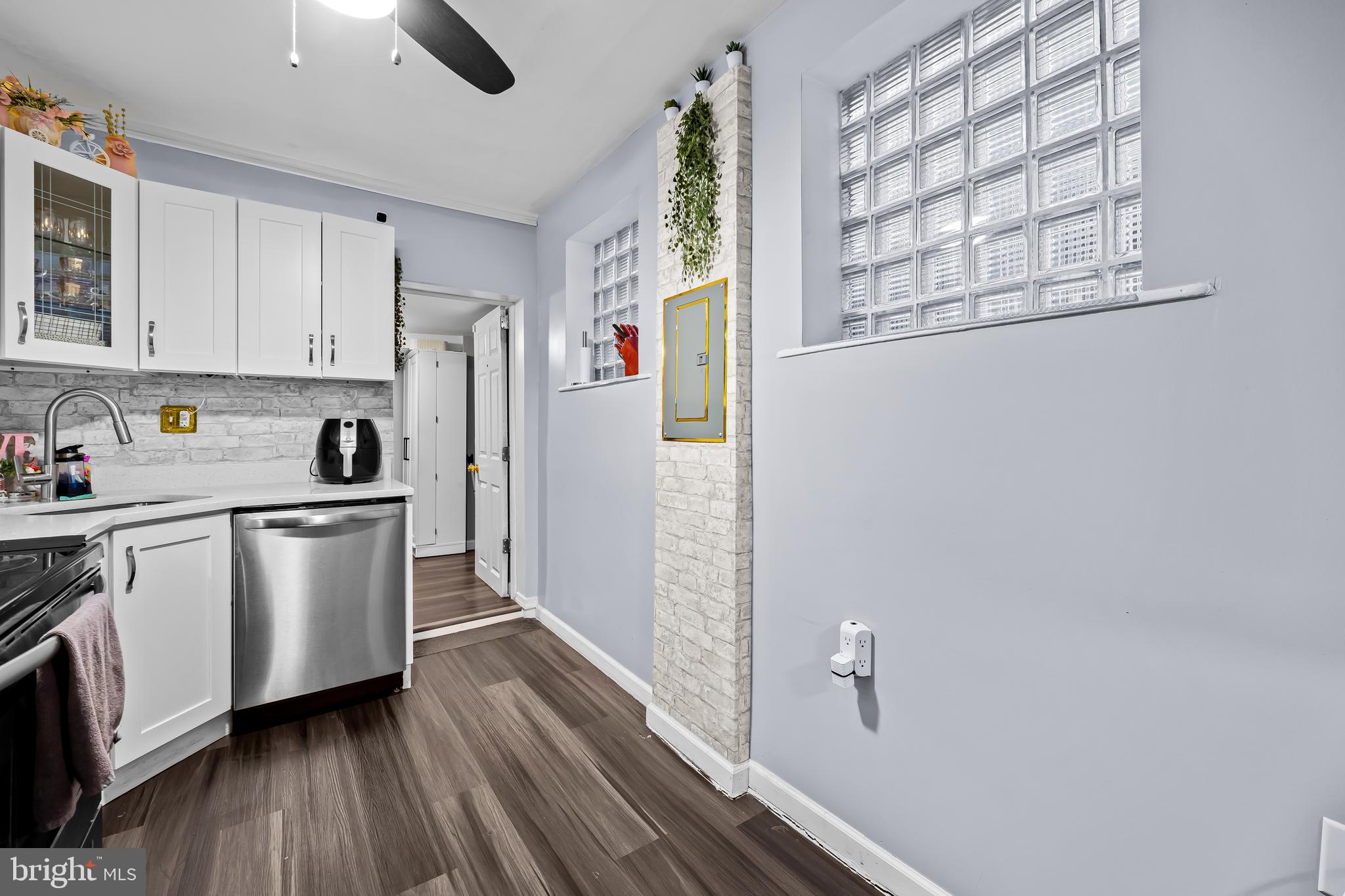 236 South Gilmor Street Baltimore, MD 21223 - Photo 10 of 28 a kitchen with a refrigerator and white cabinets