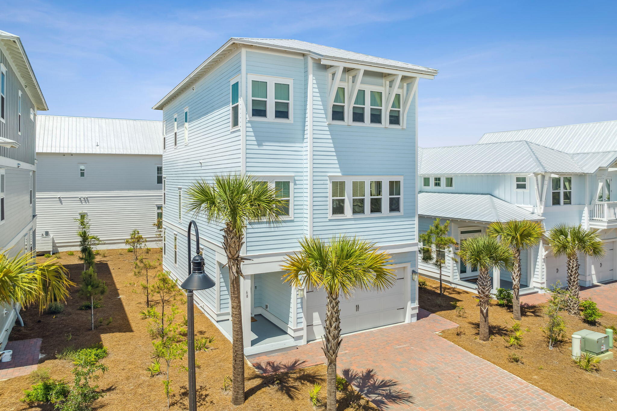 68 Candlehouse Ln Inlet Beach Inlet Beach, FL 32461 - Photo 1 of 67 a view of a patio with table and chairs potted plants