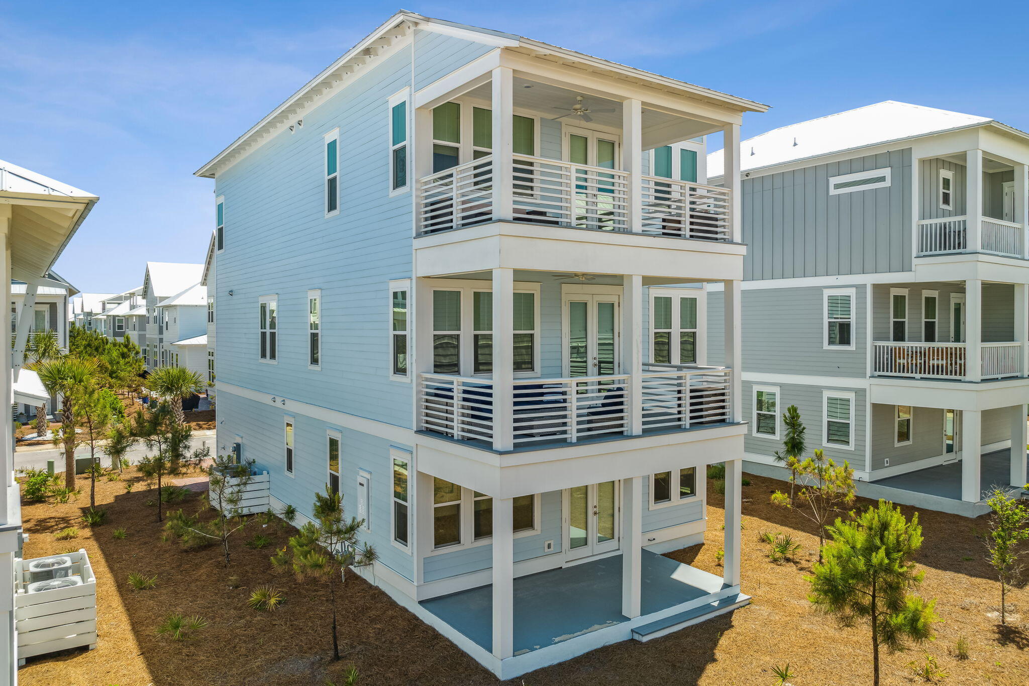 68 Candlehouse Ln Inlet Beach Inlet Beach, FL 32461 - Photo 3 of 67 a front view of a building with glass windows