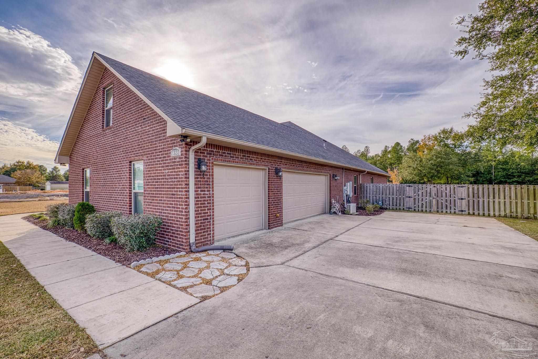 2322 Phylis Rae Drive Pace, FL 32571 - Photo 5 of 72 Oversized 3 car garage w/ extra storage closets