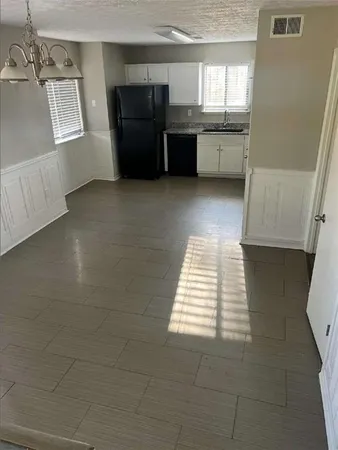 a view of an empty room and window