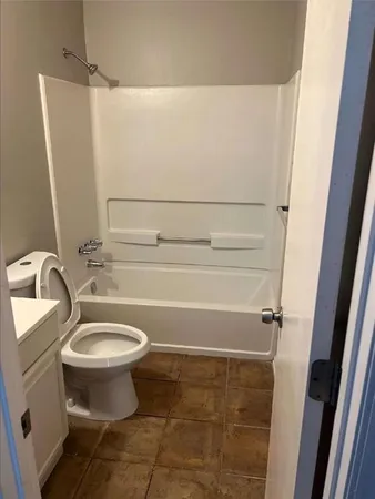 a view of a room with a wooden floor and a window