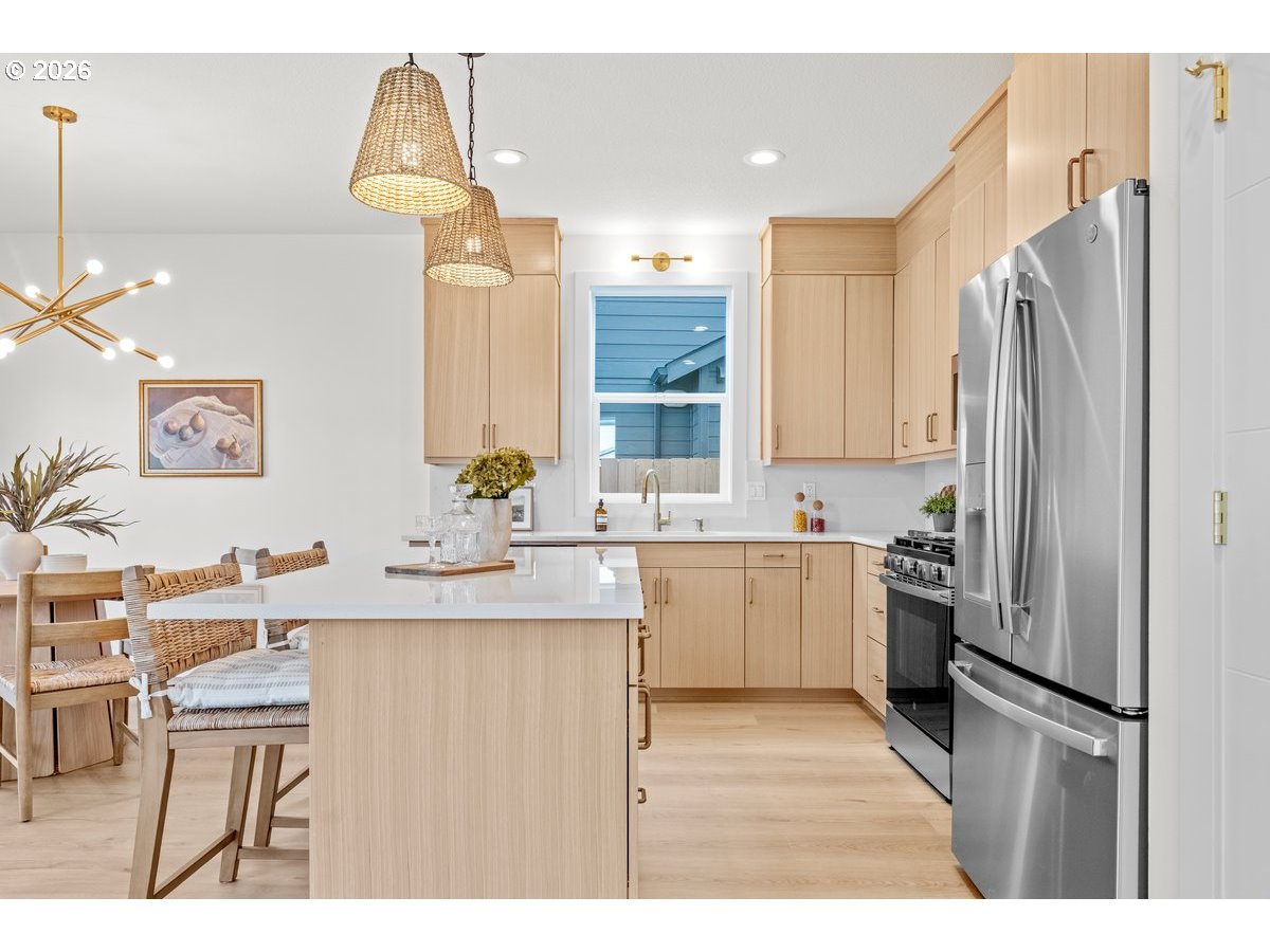 401 South 1st Street Silverton, OR 97381 - Photo 4 of 12 a kitchen with a sink appliances and cabinets