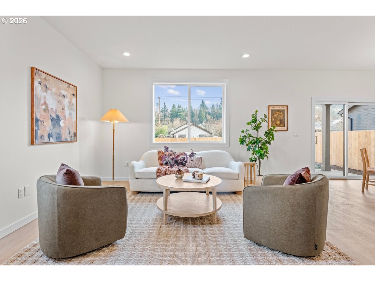 401 South 1st Street Silverton, OR 97381 - Photo 6 of 12 a living room with furniture and a potted plant