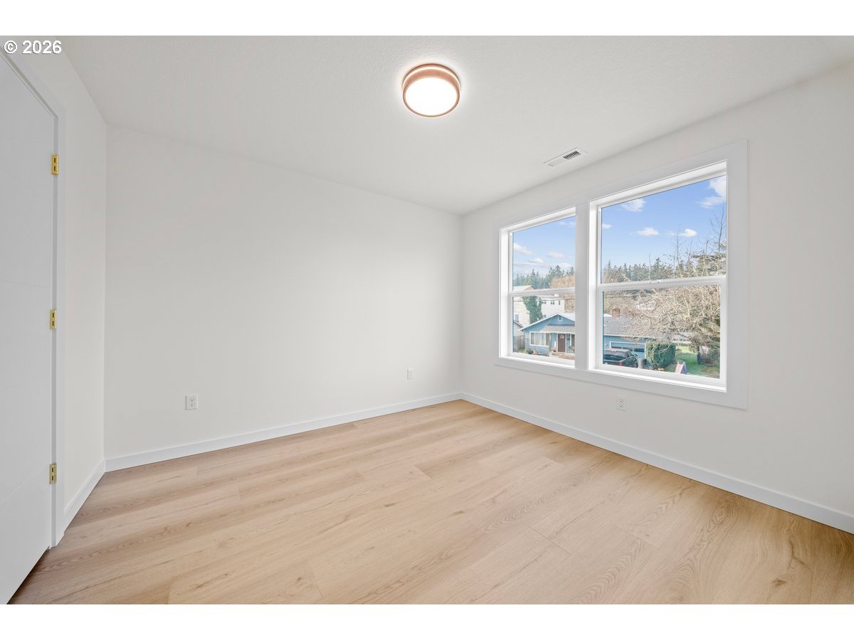 401 South 1st Street Silverton, OR 97381 - Photo 9 of 12 a view of an empty room with a window