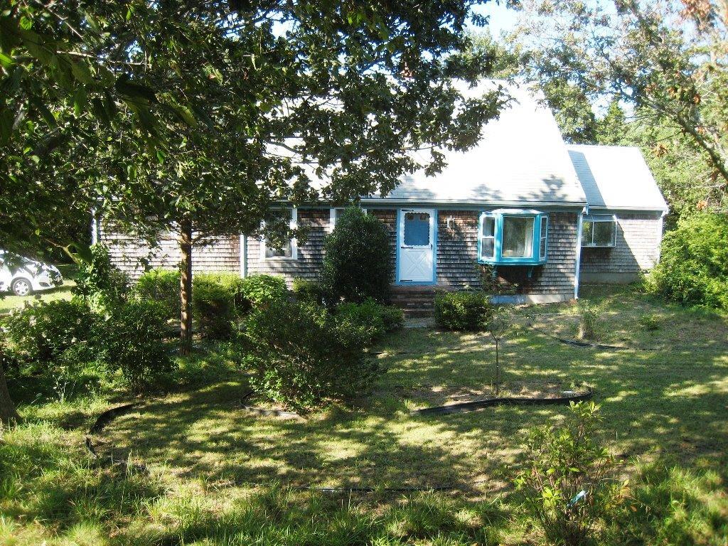 60 John Thomas Road Eastham, MA 02642 - Photo 2 of 14 a front view of house with yard and green space
