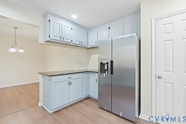 a view of a kitchen with wooden floor