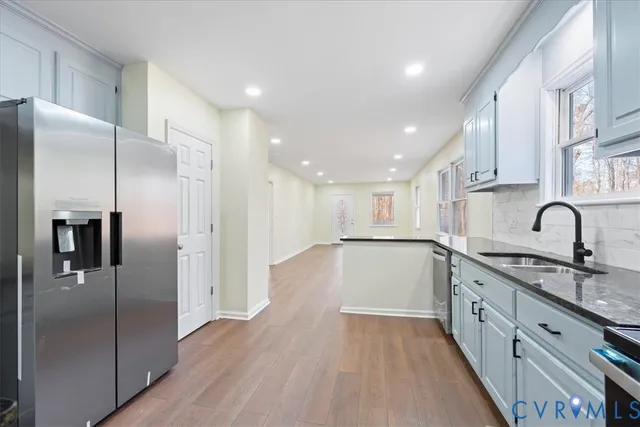 a bathroom with a sink vanity and a mirror