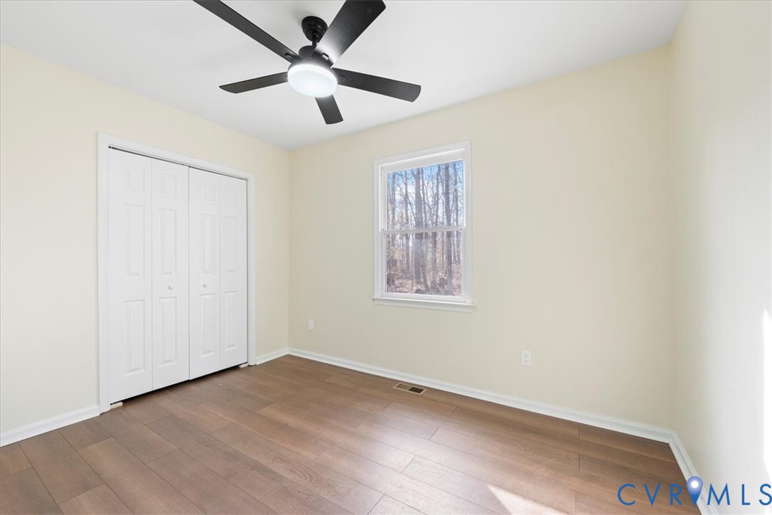 19707 Walker Avenue Colonial Heights, VA 23834 - Photo 24 of 36 an empty room with a window and a fan