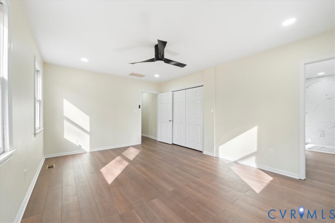 19707 Walker Avenue Colonial Heights, VA 23834 - Photo 27 of 36 a view of an empty room with wooden floor and a window