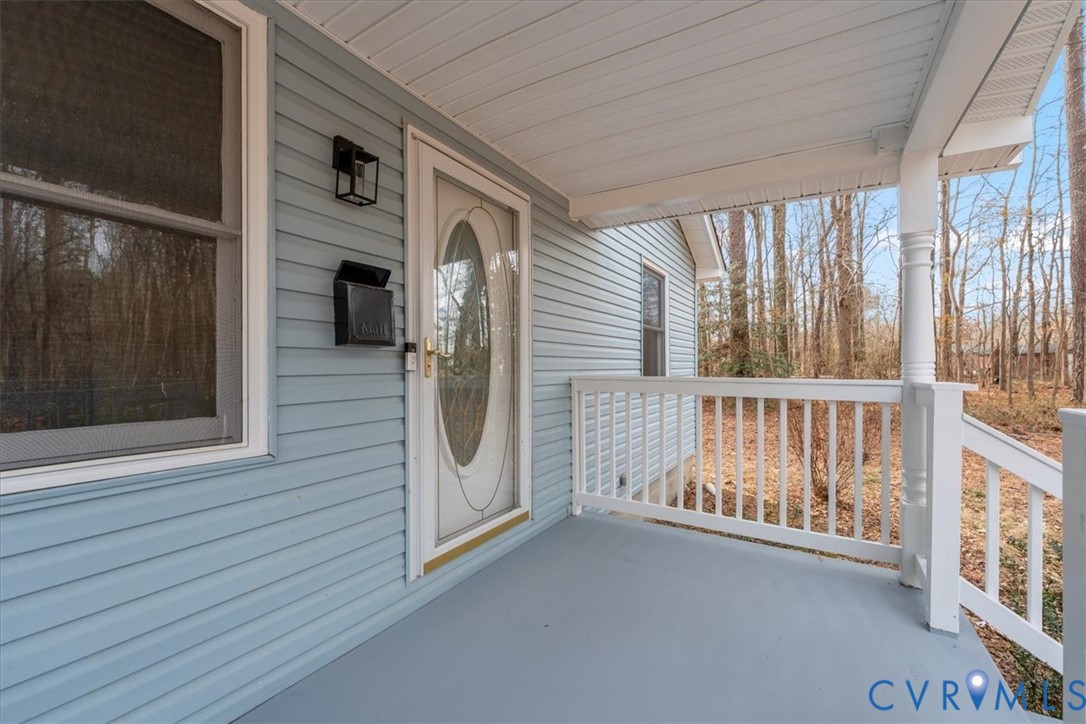 19707 Walker Avenue Colonial Heights, VA 23834 - Photo 5 of 36 a view of a hallway with a door and wooden floor