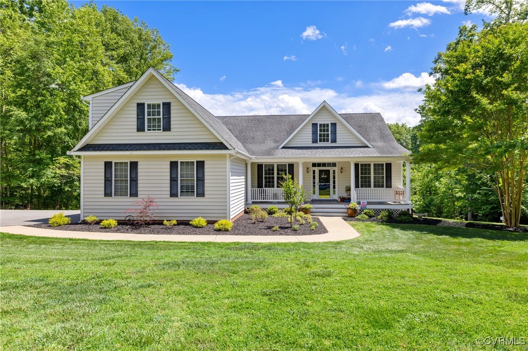 a front view of house with yard and outdoor seating